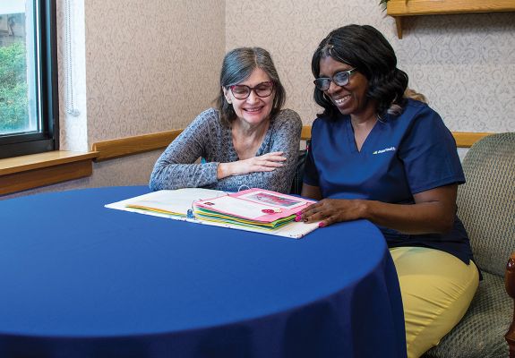 Nurse and patient looking at documents