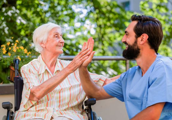 Patient and nurse high-fiving