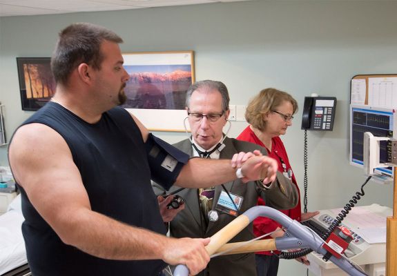 Doctor and nurse performing test on patient