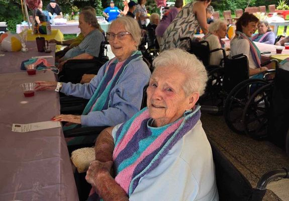 Group of elderly people at picnic event outside